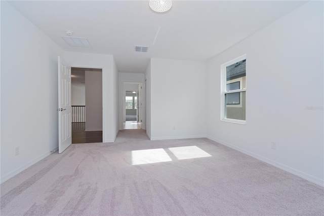 unfurnished bedroom with light colored carpet