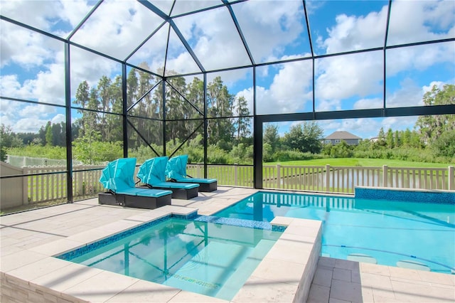 view of pool with a lanai, a water view, and a patio area