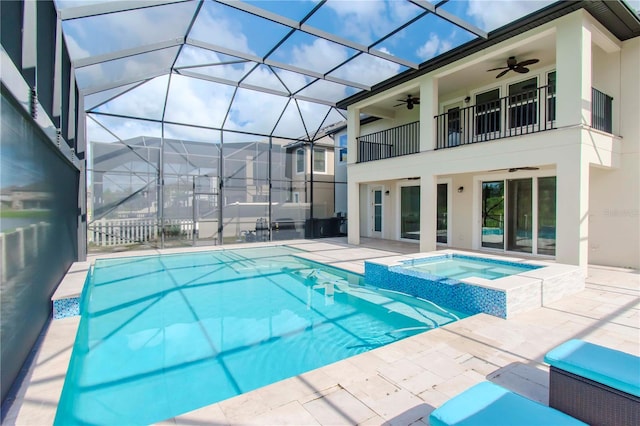 view of pool featuring ceiling fan, a patio, an in ground hot tub, and a lanai