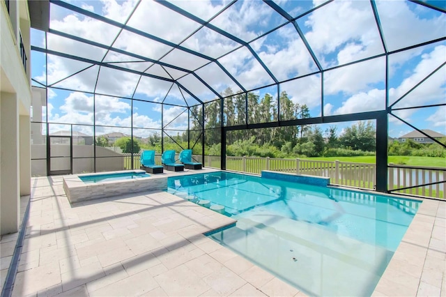 view of pool featuring an in ground hot tub, a patio, and a lanai