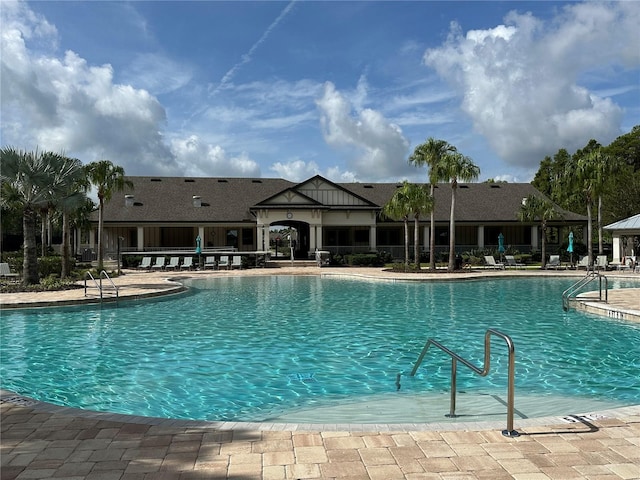 view of swimming pool featuring a patio