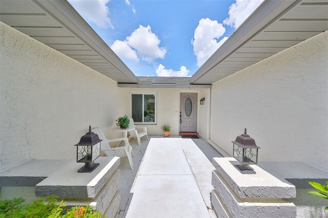 property entrance with a patio