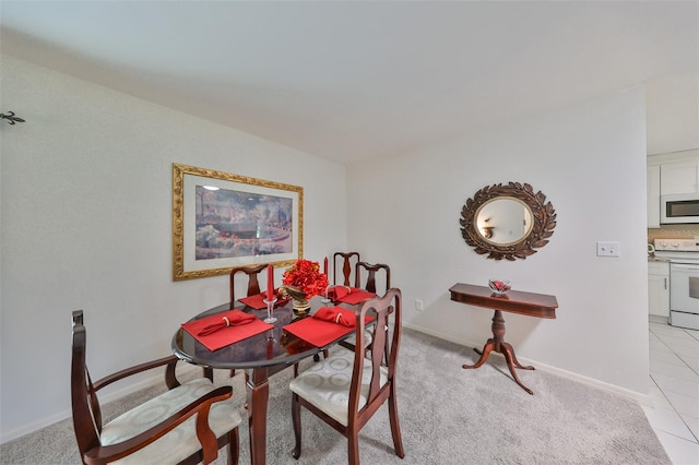 view of carpeted dining area