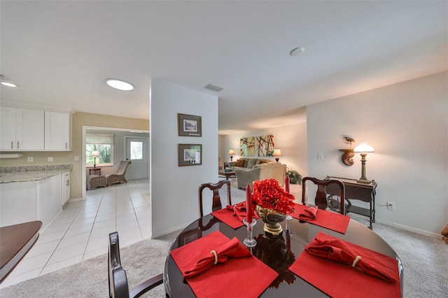 dining space with light tile patterned floors