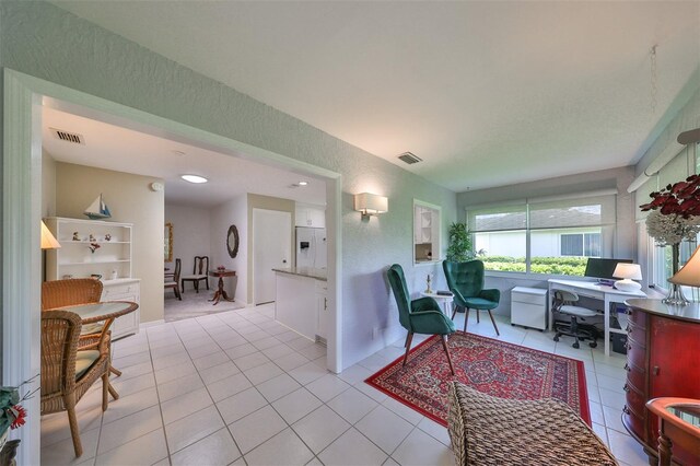 living room featuring light tile patterned flooring