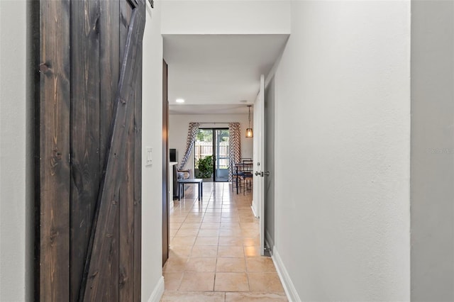 corridor with light tile patterned floors