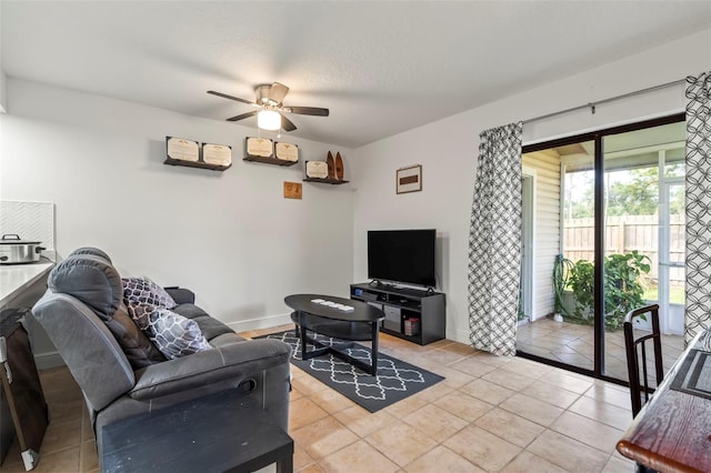 tiled living room featuring a textured ceiling and ceiling fan