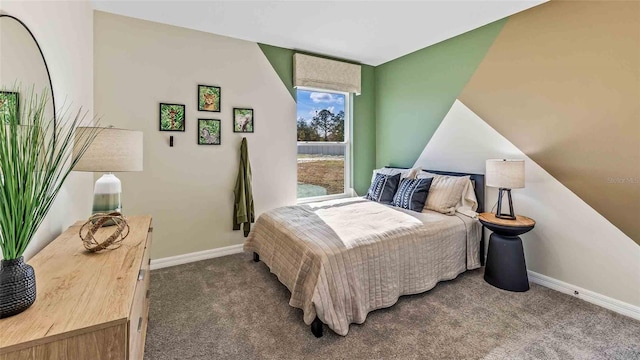 bedroom featuring vaulted ceiling and carpet floors