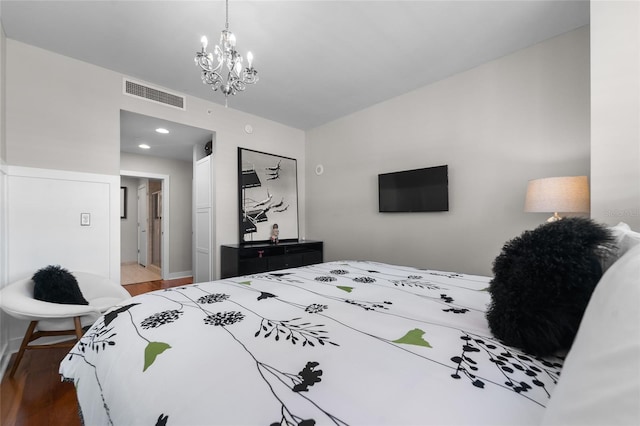 bedroom with hardwood / wood-style floors