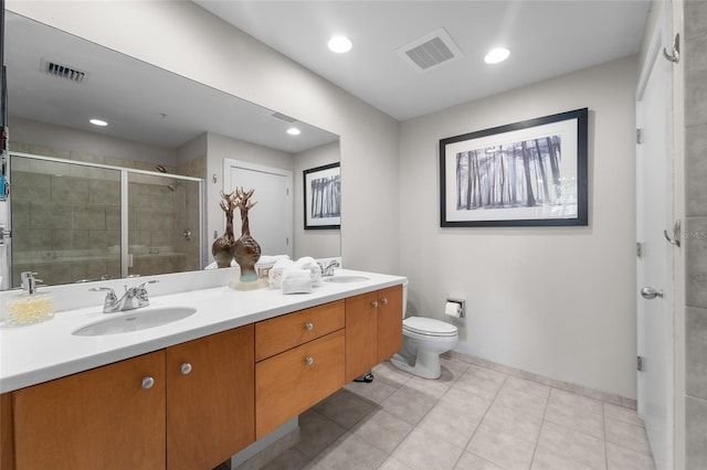 bathroom with tile patterned floors, walk in shower, toilet, and vanity