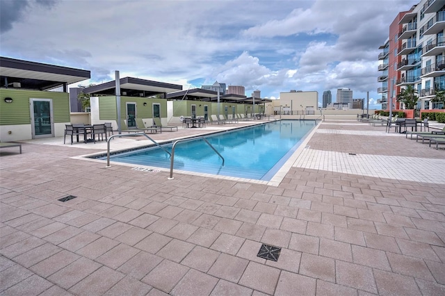 pool featuring a patio and fence