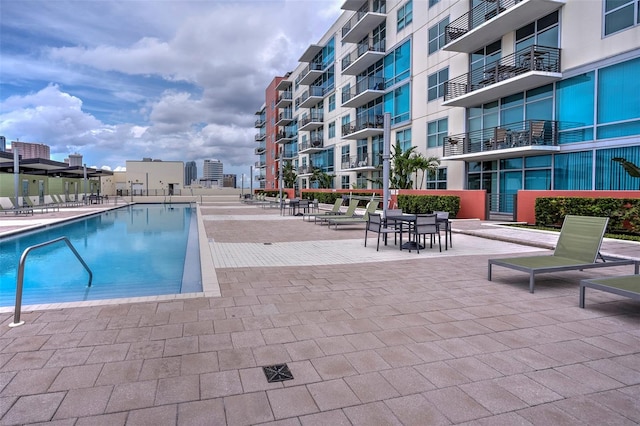 view of swimming pool with a patio