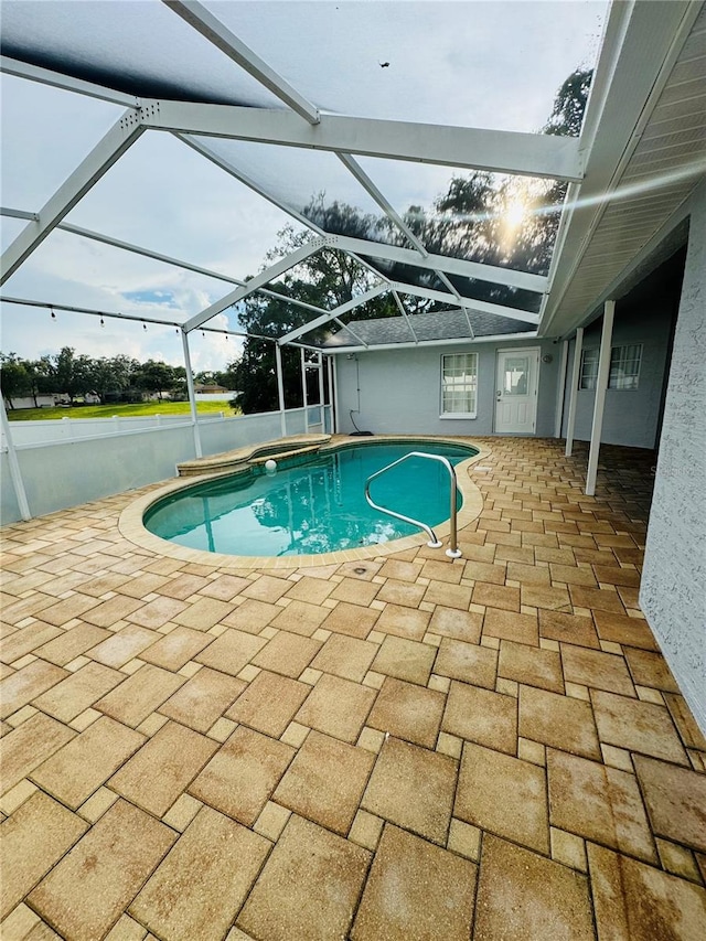 view of pool featuring a patio area and a lanai