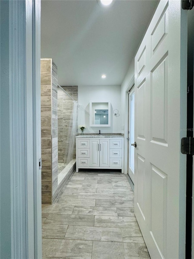 bathroom featuring vanity, a shower with curtain, and hardwood / wood-style flooring