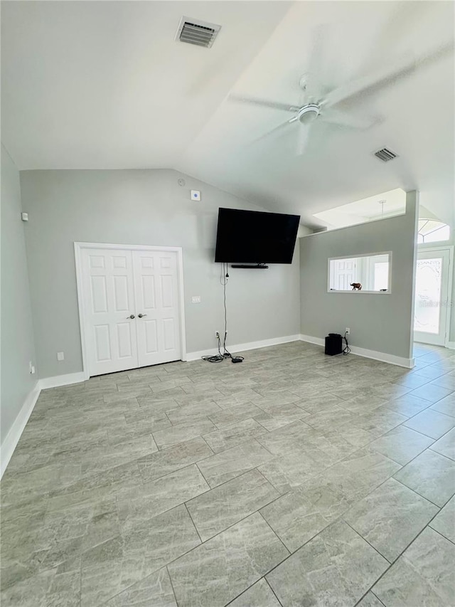 unfurnished living room featuring lofted ceiling and ceiling fan