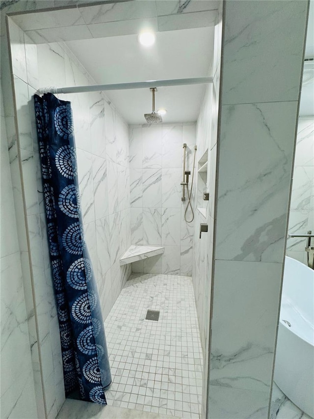 bathroom featuring separate shower and tub