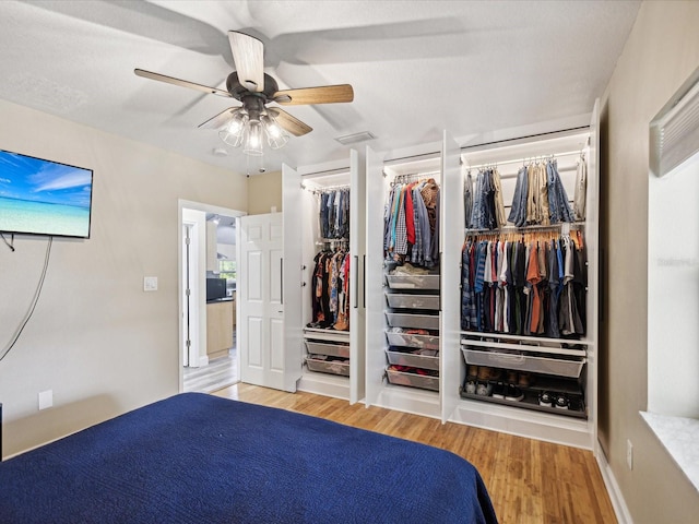 unfurnished bedroom with ceiling fan and light hardwood / wood-style floors