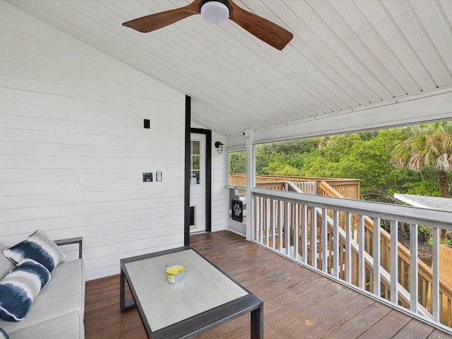 wooden terrace featuring ceiling fan