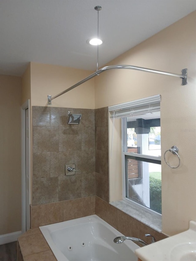 bathroom featuring independent shower and bath