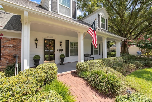 entrance to property featuring covered porch