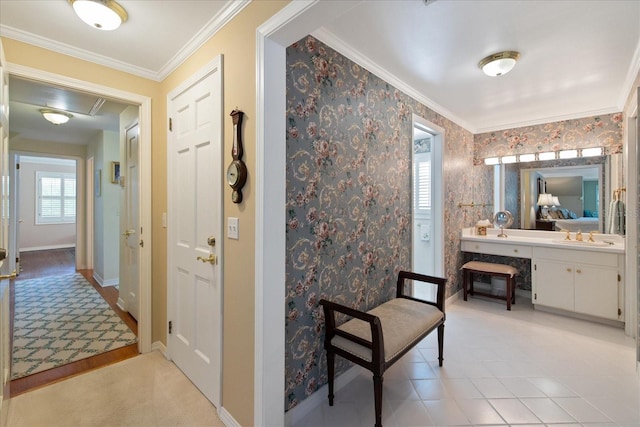 bathroom with tile patterned flooring, crown molding, and vanity