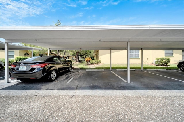 view of vehicle parking with a carport