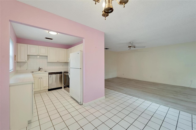 kitchen featuring dishwasher, light hardwood / wood-style flooring, sink, white fridge, and ceiling fan