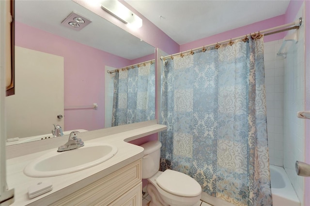 full bathroom with tile patterned flooring, vanity, toilet, and shower / bath combo with shower curtain