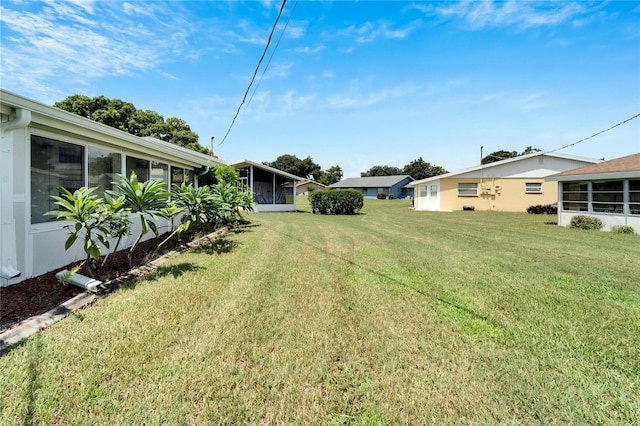 view of yard with a sunroom