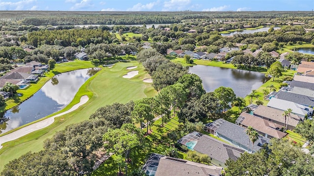 aerial view featuring a water view, view of golf course, and a residential view