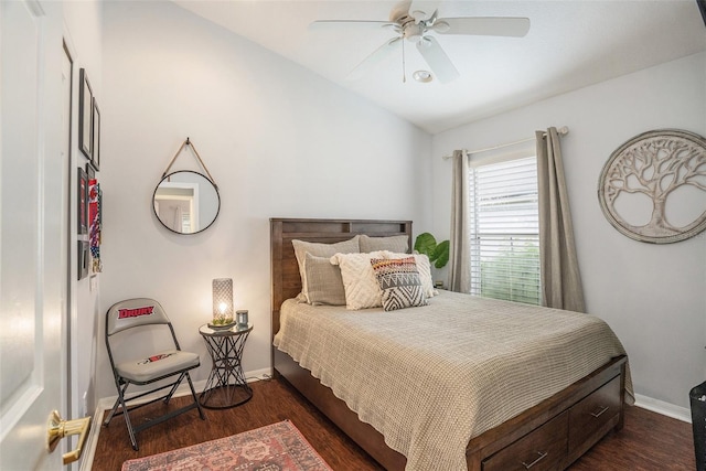 bedroom featuring vaulted ceiling, baseboards, dark wood finished floors, and a ceiling fan