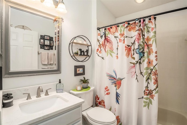 full bath with shower / bath combo, vanity, and toilet