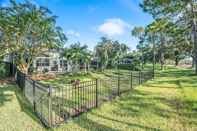 view of yard featuring a lanai and fence private yard