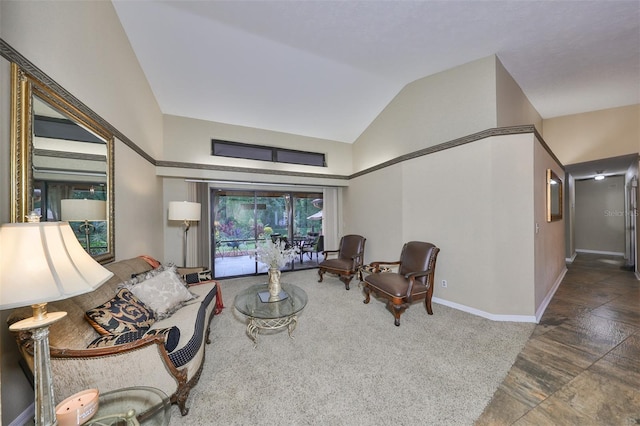 living room with vaulted ceiling and dark carpet