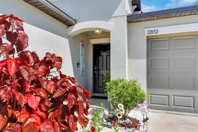 doorway to property featuring a garage