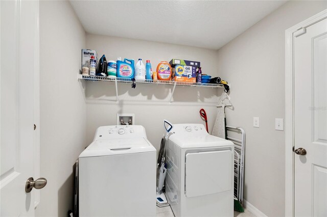 laundry area with separate washer and dryer