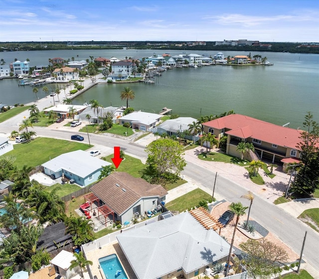 birds eye view of property with a water view