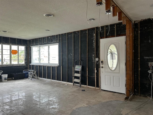 entrance foyer with a textured ceiling