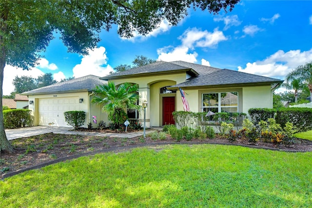 view of front facade with a front lawn and a garage