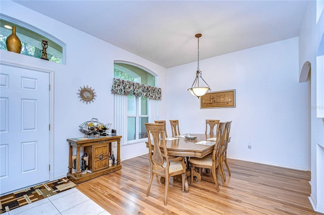 dining space with hardwood / wood-style floors