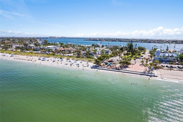 birds eye view of property with a view of the beach and a water view