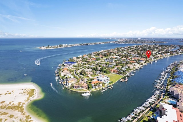 bird's eye view with a water view and a beach view