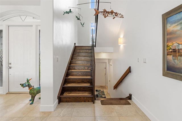 stairs with tile patterned floors