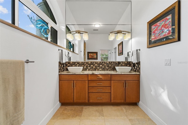 bathroom featuring backsplash and vanity