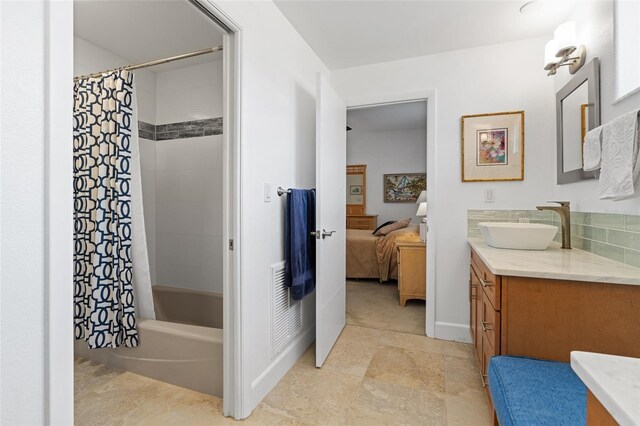 bathroom featuring vanity and shower / bath combo with shower curtain