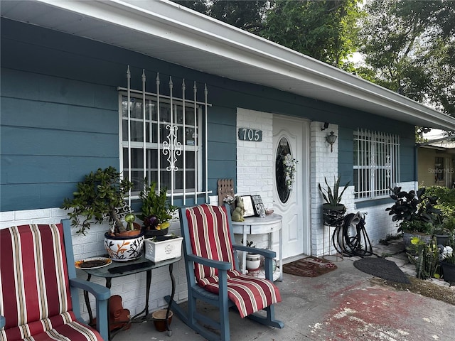 property entrance featuring covered porch