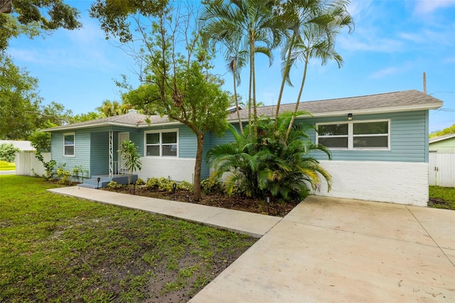 ranch-style house with a front yard