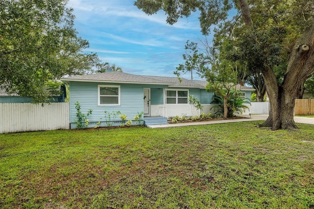 single story home featuring a front yard