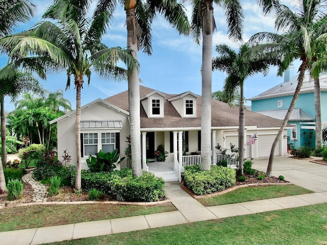 view of front facade featuring a garage and covered porch