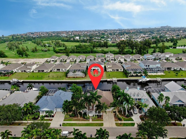 aerial view of residential area with a large body of water